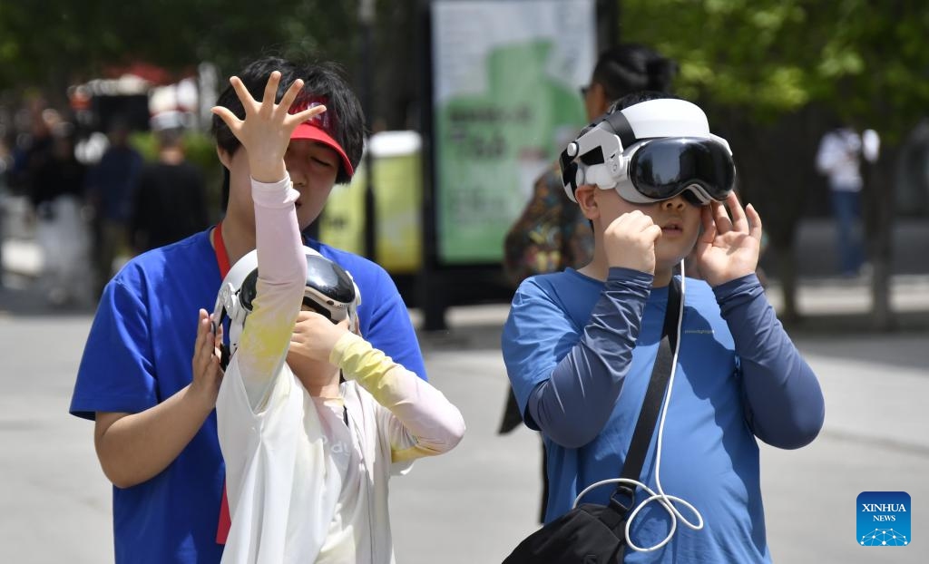 Tourists visit the 798 Art Zone in Beijing, capital of China, July 16, 2025. Built on the site of an abandoned factory complex, the 798 Art Zone, with age-old auburn bricks of its facade that are reminiscent of its industrial past, becomes a renowned place for museums and galleries of contemporary art. The art zone recorded 12.57 million visits in 2024. (Photo: Xinhua)