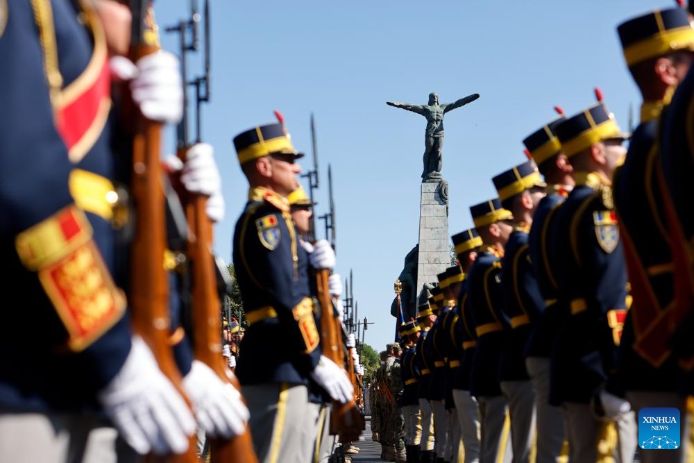 Soldiers attend celebrations of the Romanian Aviation and Air Force Day in front of the Statue of Air Heroes in Bucharest, Romania, July 20, 2025. (Photo: Xinhua)