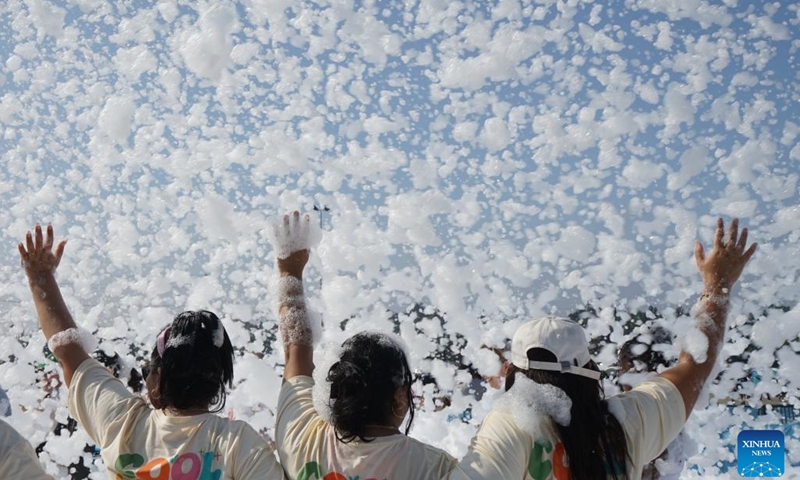 People participate in the Bubble Run in Pomona, Los Angeles County, California, the United States, July 19, 2025. The annual Bubble Run took place Saturday at the Pomona Fairplex in Pomona, drawing over 8,000 participants. (Photo: Xinhua)