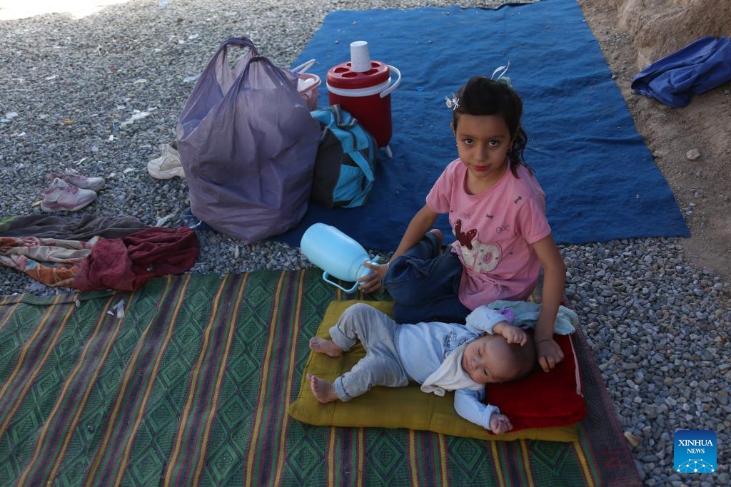 Afghan children are seen at a makeshift camp in Kabul, Afghanistan, July 20, 2025. More than 1,500 Afghan refugee families returned to their homeland, Afghanistan, from the neighboring Iran and Pakistan in a single day on Saturday, reported the state-owned Bakhtar news agency on Sunday. (Photo: Xinhua)