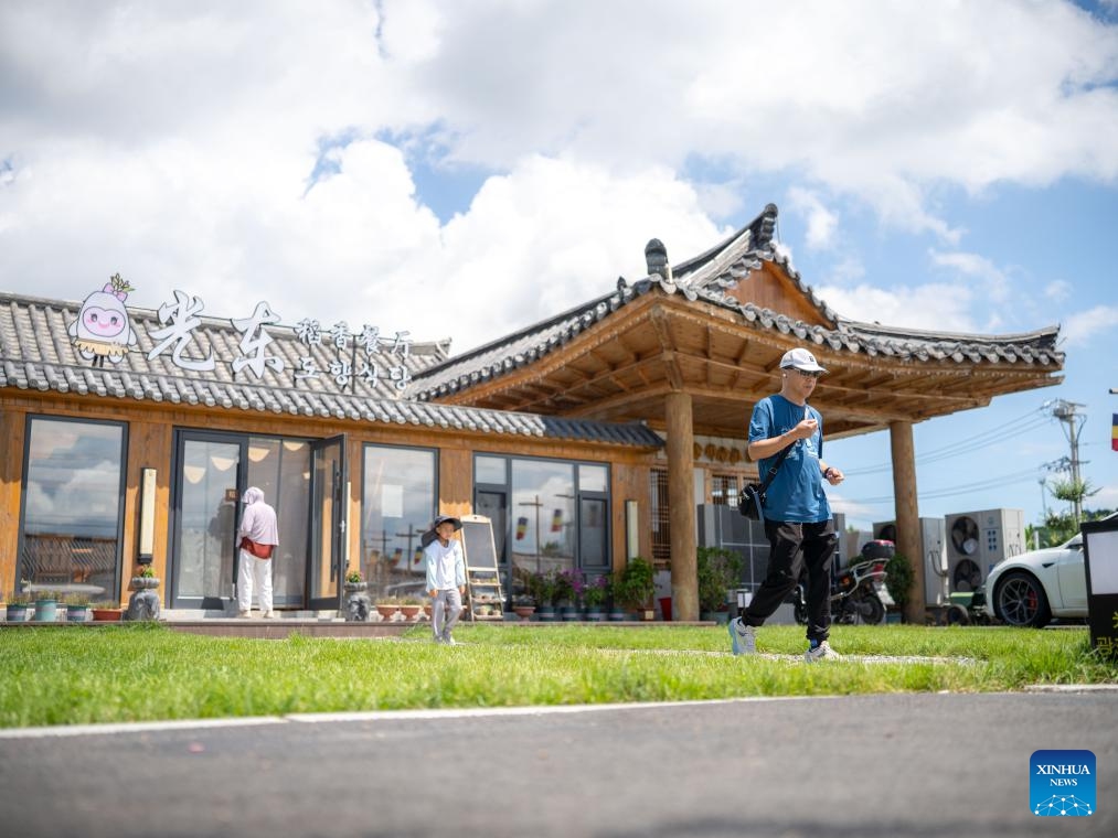 People visit the Guangdong Village, Helong City, northeast China's Jilin Province, July 18, 2025. Guangdong, a border village in Jilin Province of northeast China, received over 200,000 visits in 2024, accumulating an income of over 1 million yuan (about 139,317 U.S. dollars). (Photo:Xinhua)
