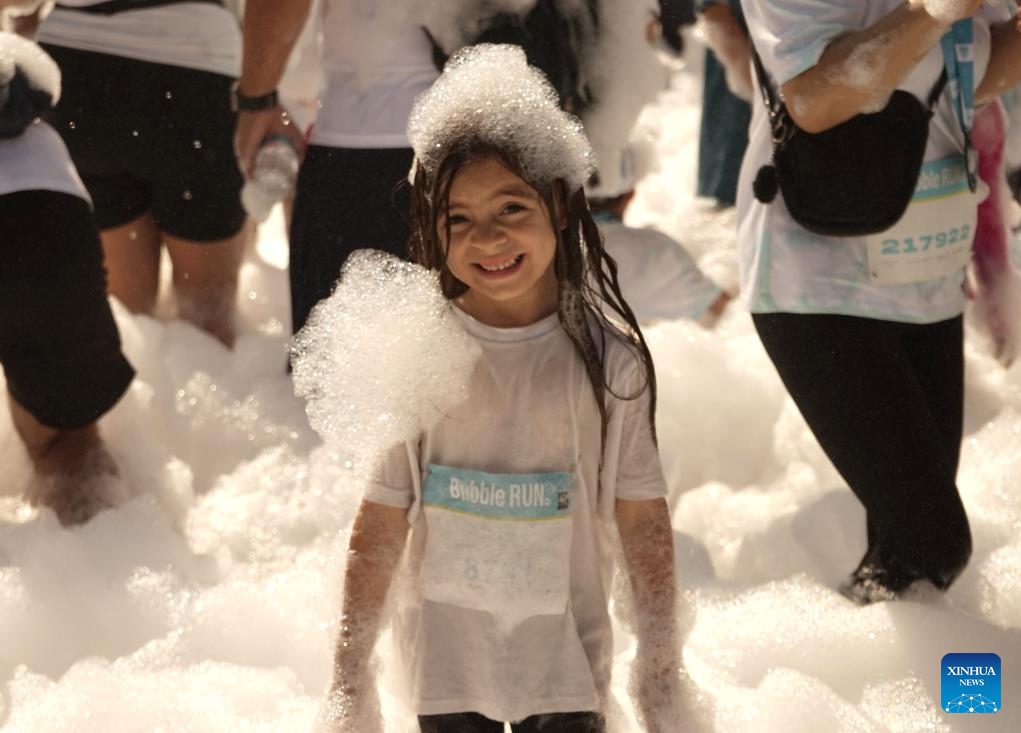A child participates in the Bubble Run in Pomona, Los Angeles County, California, the United States, July 19, 2025. The annual Bubble Run took place Saturday at the Pomona Fairplex in Pomona, drawing over 8,000 participants. (Photo: Xinhua)