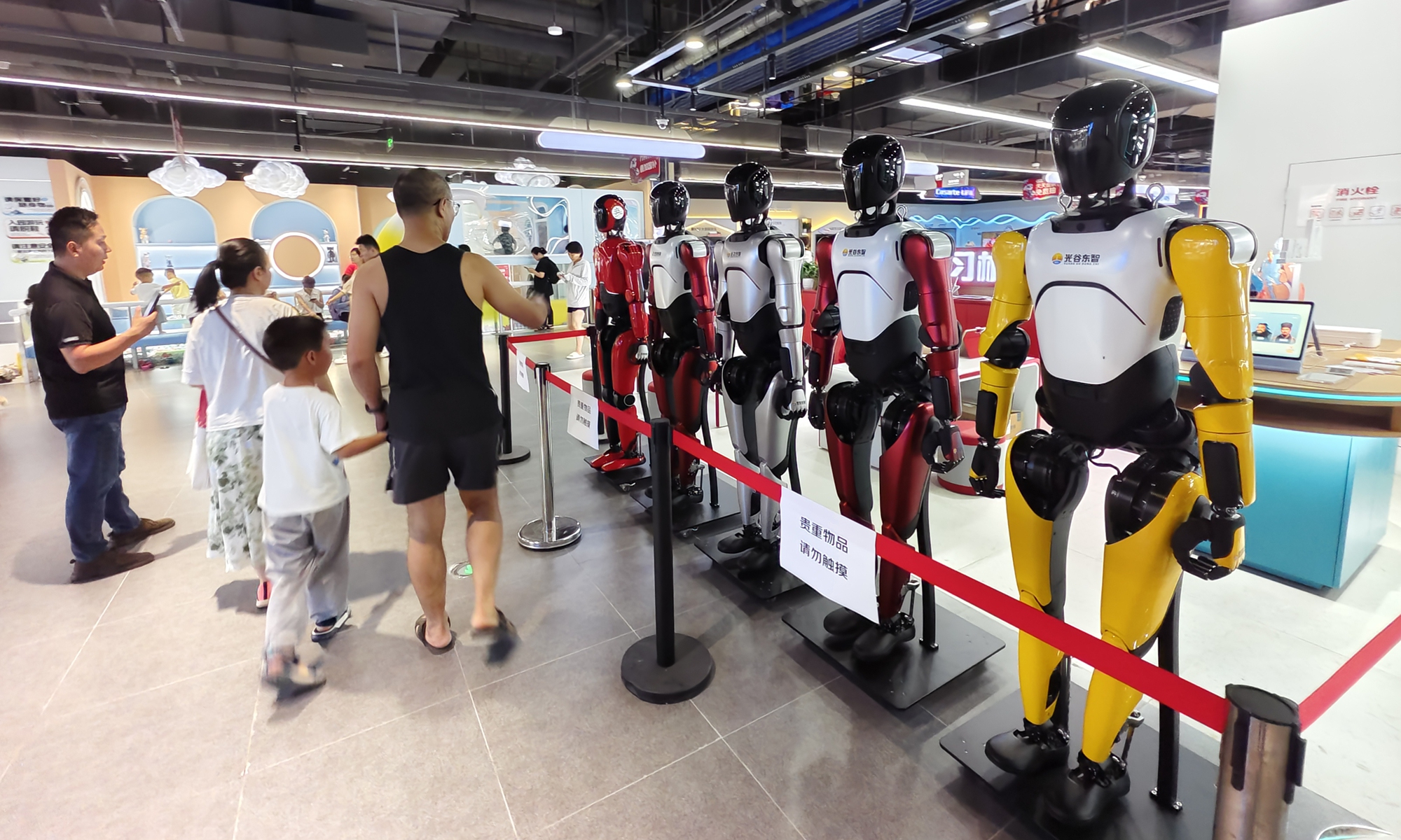 Five humanoid robots draw wide attention from crowds at the newly opened JD MALL in the East Lake High-tech Development Zone, also known as the Optics Valley of China, in Wuhan, Central China's Hubei Province, on June 15, 2025. Photo: VCG