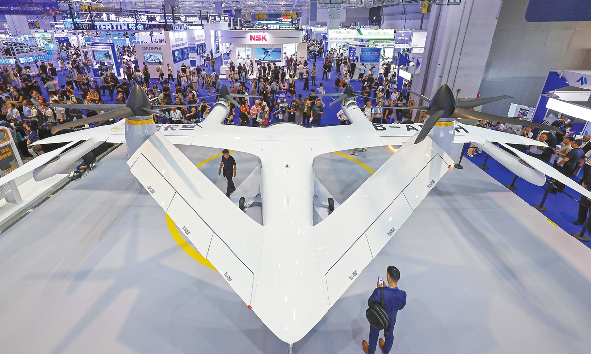 Visitors explore the Volocopter tiltrotor manned eVTOL aircraft on display at the Shanghai International Low-Altitude Economy Expo in Shanghai on July 23, 2025. Photo: VCG