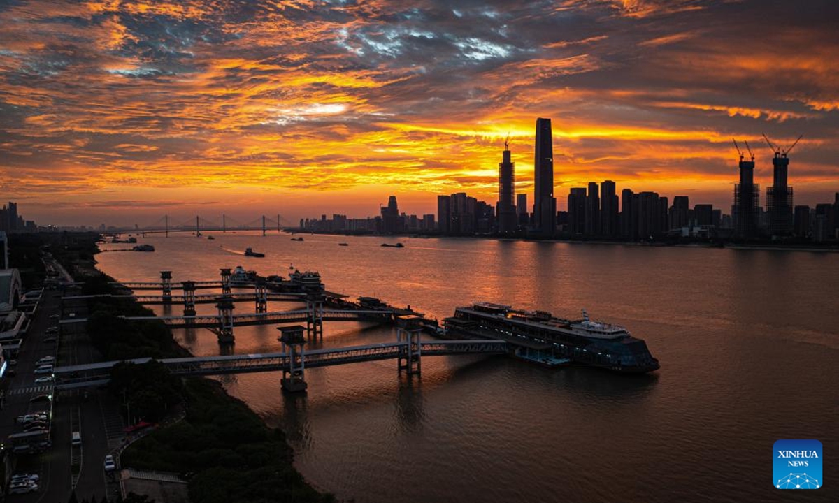 A drone photo taken on July 26, 2025 shows the morning glow over Wuhan, central China's Hubei Province. (Xinhua/Xiao Yijiu)