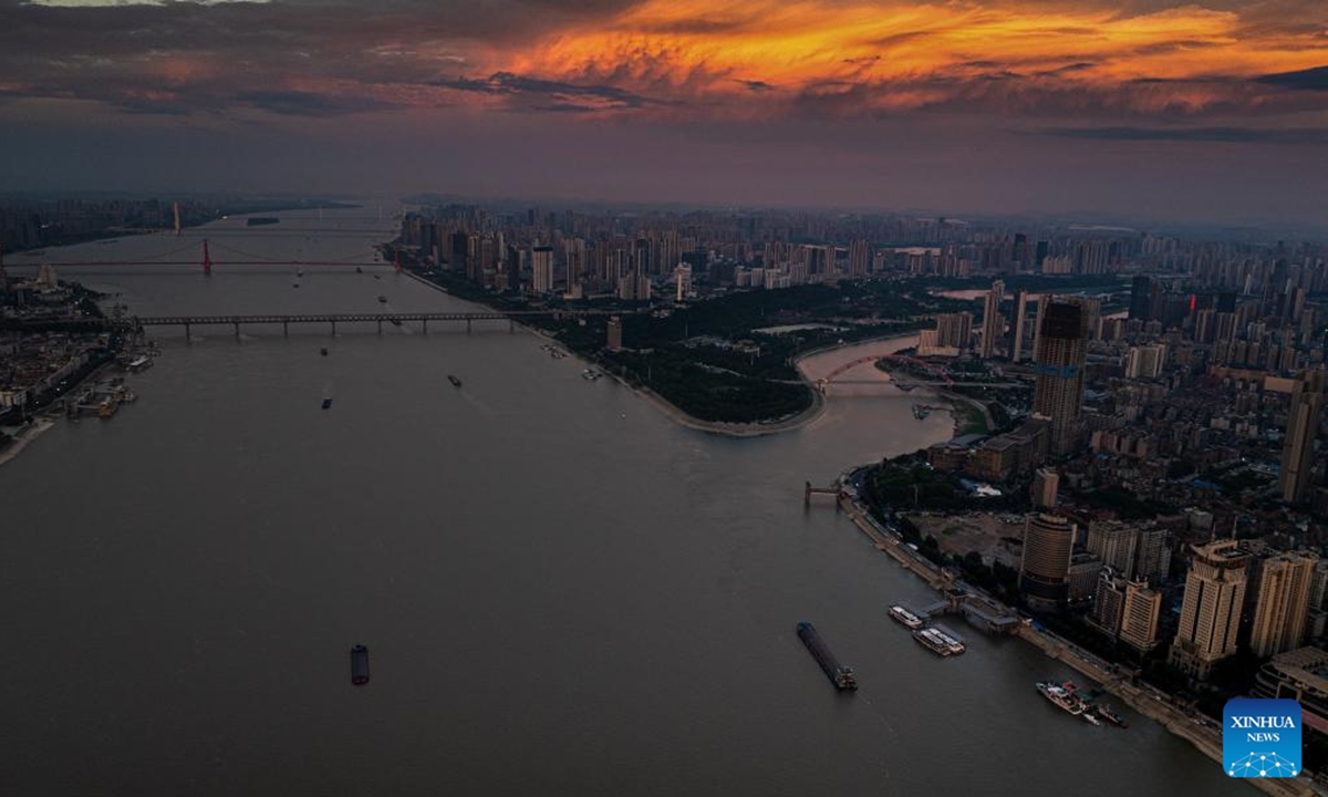 A drone photo taken on July 26, 2025 shows the morning glow over Wuhan, central China's Hubei Province. (Xinhua/Xiao Yijiu)