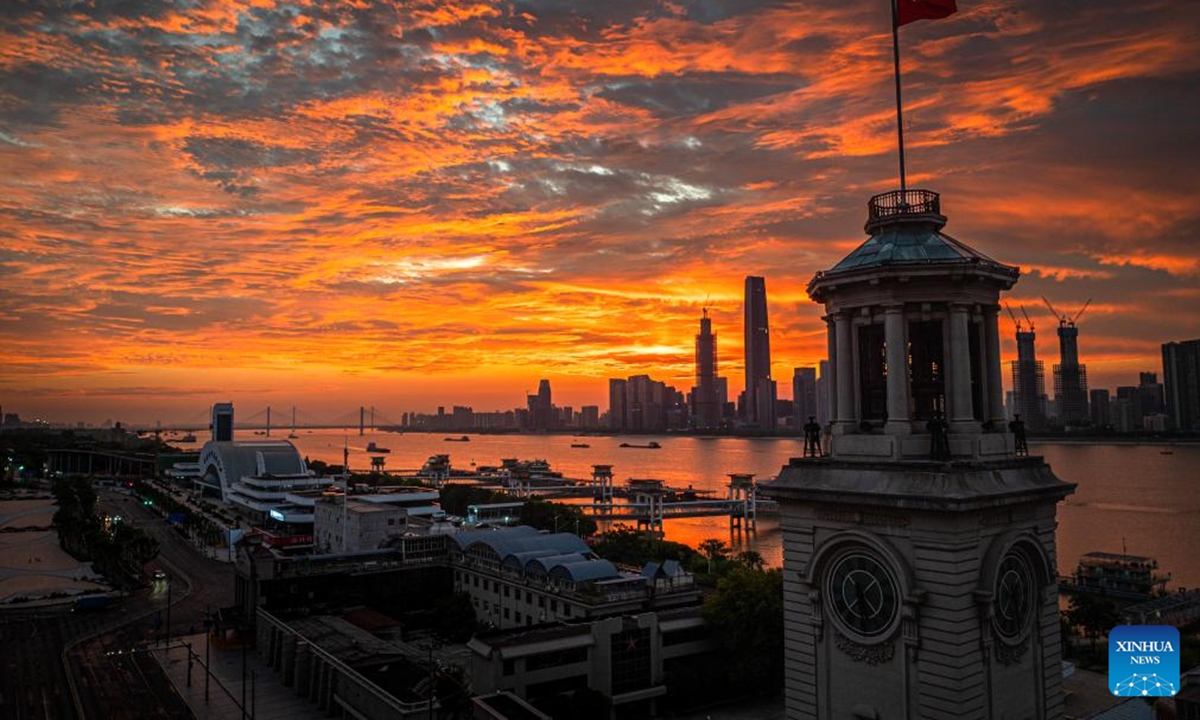 A drone photo taken on July 26, 2025 shows the morning glow over Wuhan, central China's Hubei Province. (Xinhua/Xiao Yijiu)