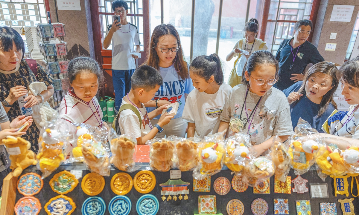 Visitors select products at a cultural and creative store in the Altar of the God of Agriculture (Xiannongtan Temple), located on the Beijing Central Axis, on July 24, 2025. Photo: Li Hao/GT