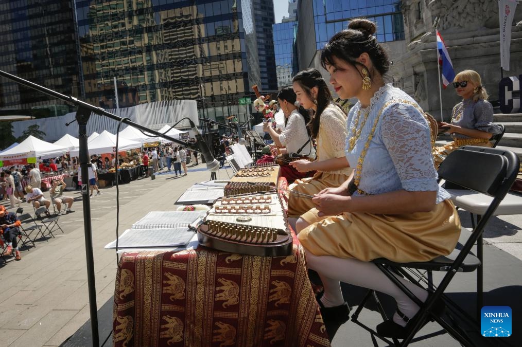 Performers play traditional music during the 2025 Thai Festival in Vancouver, British Columbia, Canada, July 27, 2025. The annual Thai Festival featured traditional food, music, dance, crafts and cultural performances, highlighting Thailand's rich and vibrant culture.（Photo: Xinhua)