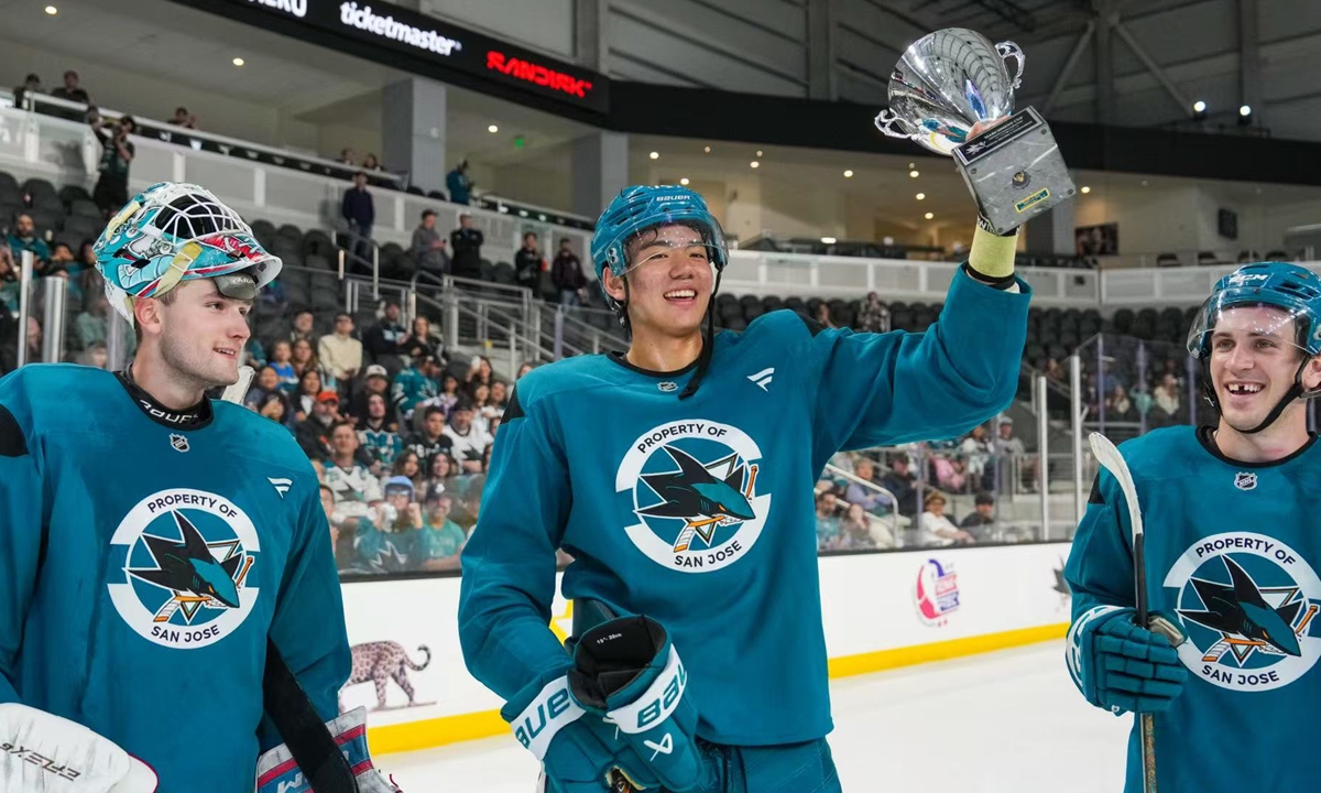 Wang Haoxi lifts a trophy during a San Jose Sharks event on July 4, 2025. Photo: Courtesy of Wang Haoxi