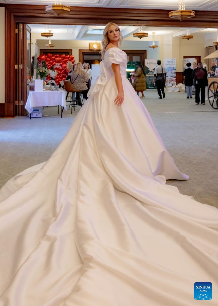 A model displays a wedding dress at Canberra Fair in Canberra, Australia, July 27, 2025. The 2025 edition of the annual wedding and lifestyle themed fair was held at the Old Parliament House of Australia on Sunday. (Photo: Xinhua)