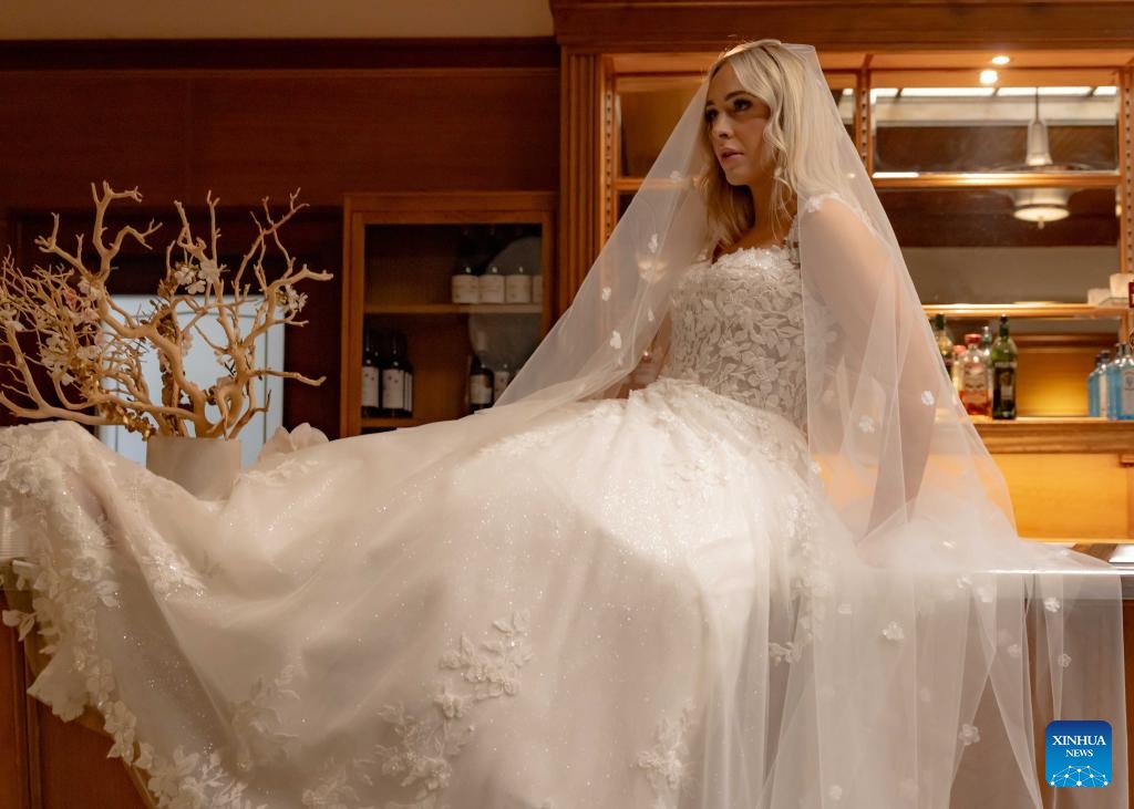 A model displays a wedding dress at Canberra Fair in Canberra, Australia, July 27, 2025. The 2025 edition of the annual wedding and lifestyle themed fair was held at the Old Parliament House of Australia on Sunday. (Photo: Xinhua)