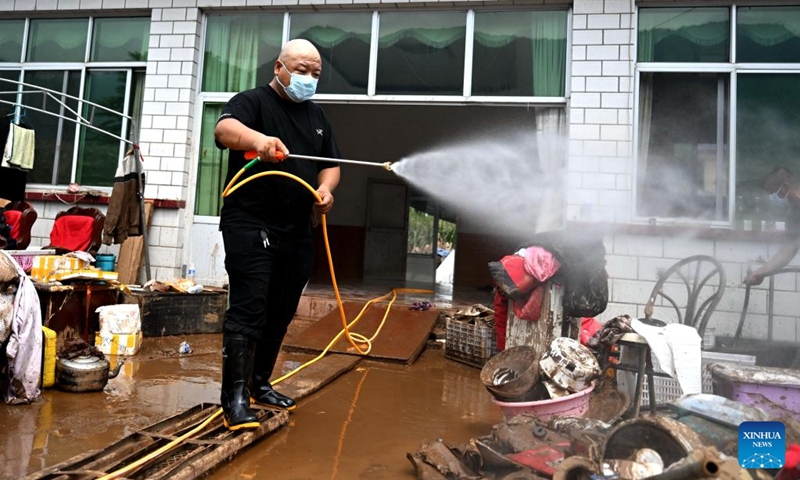 A staff member conducts disinfection operations in Nantai Village in Liudaohe Town, Xinglong County of north China's Hebei Province, Aug. 2, 2025. Affected by heavy rainfall, some roads and houses were damaged in several villages in Liudaohe Town. In recent days, local authorities have organized efforts to carry out relief operations to restore roads, power supply and communication facilities, along with environmental disinfection measures. Photo: Xinhua