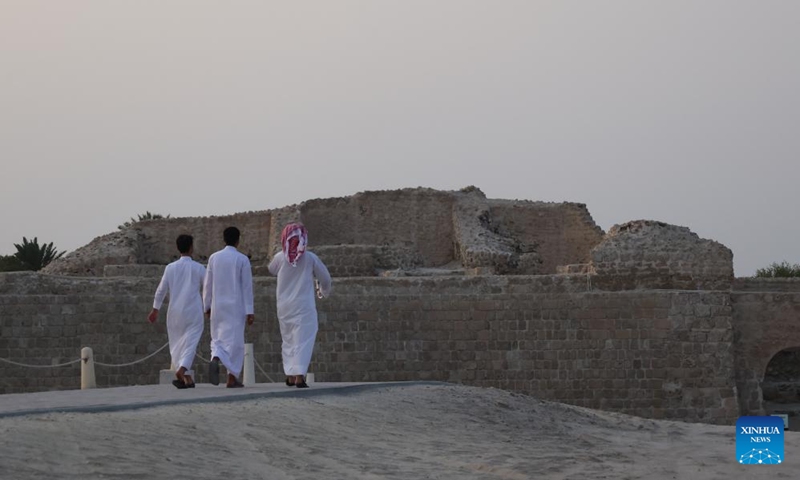 Tourists visit Qal'at al-Bahrain in the Northern Governorate, Bahrain, Aug. 2, 2025.

Situated on the northern coast of Bahrain Island, Qal'at al-Bahrain is an artificial mound created by many successive layers of human occupation. It was listed as a UNESCO World Heritage Site in 2005. Photo: Xinhua