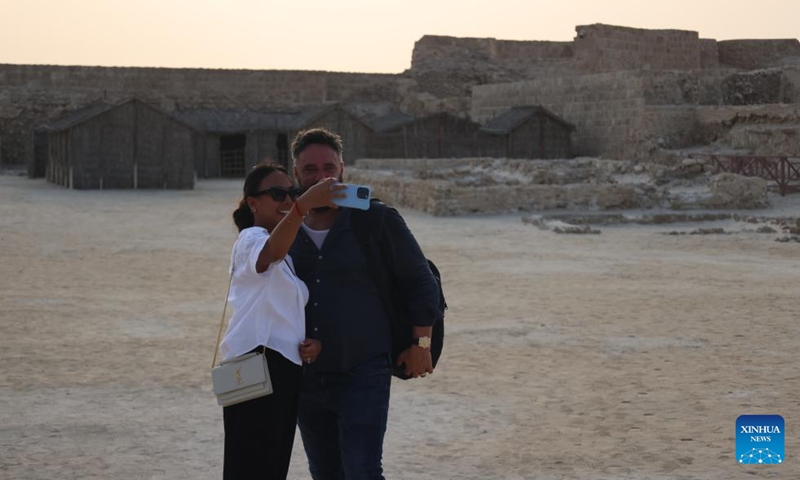 Tourists take selfies at Qal'at al-Bahrain in the Northern Governorate, Bahrain, Aug. 2, 2025.

Situated on the northern coast of Bahrain Island, Qal'at al-Bahrain is an artificial mound created by many successive layers of human occupation. It was listed as a UNESCO World Heritage Site in 2005. Photo: Xinhua