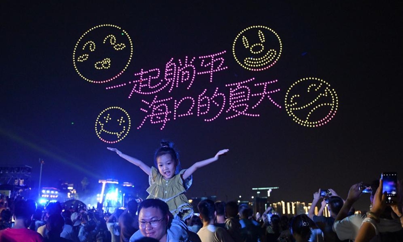 People watch a drone light show at the opening ceremony of the 2025 (26th) Hainan Island Carnival in Haikou, south China's Hainan Province, Aug. 2, 2025. The 2025 (26th) Hainan Island Carnival kicked off on Saturday here. With various activities arranged across the island, the event will last till Aug. 31. Photo: Xinhua