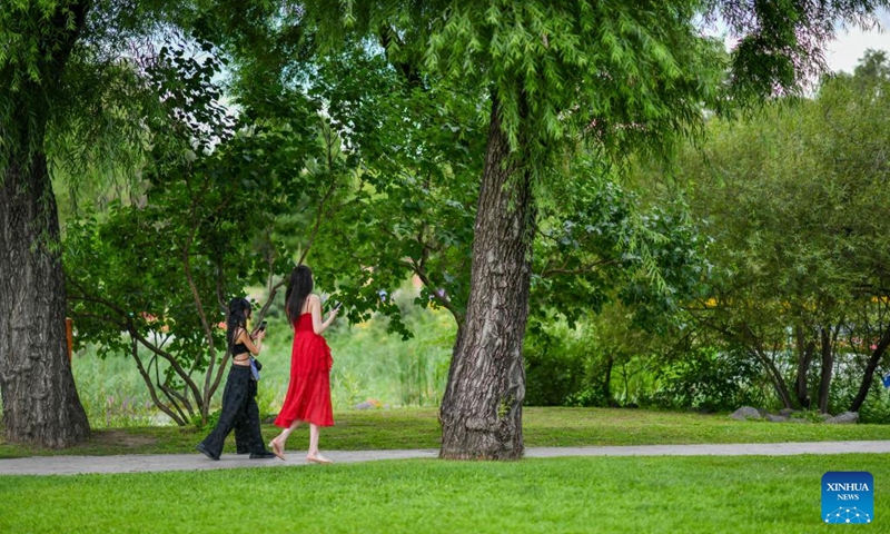 People visit the Sun Island Scenic Area in Harbin, northeast China's Heilongjiang Province, Aug. 1, 2025. Located on the north bank of the Songhua River in Harbin, the Taiyangdao (Sun Island) National Wetland Park has a wetland area of more than 7,000 hectares, with a high wetland rate of more than 70 percent. Among them, the Sun Island Scenic Area is one of the few riverfront wetland grassland ecological zones lying in the city center in China.

In midsummer, the charming scenery of the vibrant urban ecological island attracts numerous tourists. Photo: Xinhua