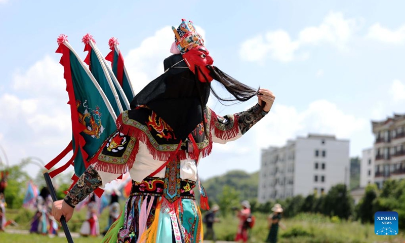 Actors stage a Dixi opera performance at the Miaoling Tunpu scenic area in Xixiu District of Anshun City, southwest China's Guizhou Province, Aug. 2, 2025. Anshun Dixi Opera is an important part of Tunpu culture dating back to the Ming Dynasty (1368-1644). The opera has been listed as a national intangible cultural heritage item in 2006. Photo: Xinhua