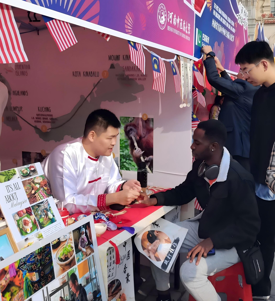 Myanmar international student Zaw Win Maung showcases traditional Chinese medicine culture at the first Henan International Cultural Festival for Educators and Students From China and Abroad, in November 2024. Photo: Courtesy of Zaw Win Maung