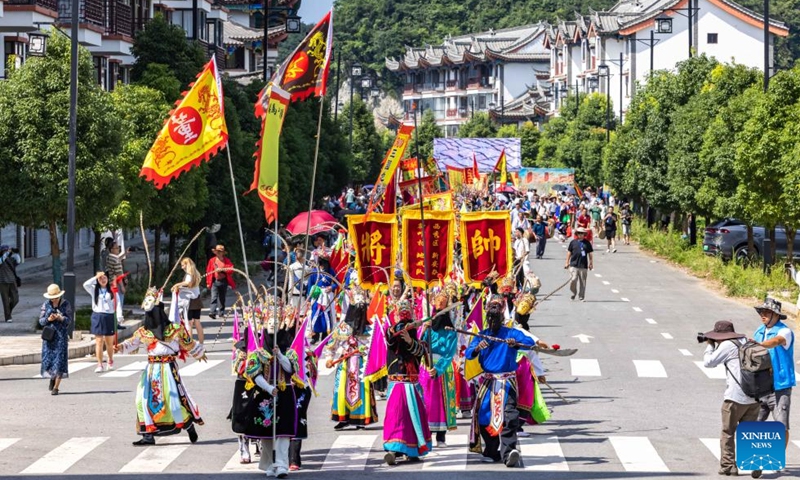 Actors take part in a Dixi opera parade at the Miaoling Tunpu scenic area in Xixiu District of Anshun City, southwest China's Guizhou Province, Aug. 2, 2025. Anshun Dixi Opera is an important part of Tunpu culture dating back to the Ming Dynasty (1368-1644). The opera has been listed as a national intangible cultural heritage item in 2006. Photo: Xinhua