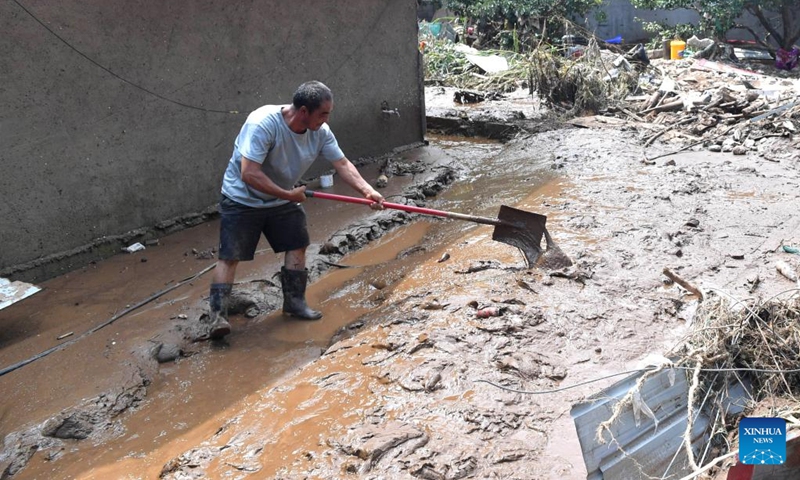 A villager cleans up silt in Liudaogou Village in Liudaohe Town, Xinglong County of north China's Hebei Province, Aug. 1, 2025. Affected by heavy rainfall, some roads and houses were damaged in several villages in Liudaohe Town. In recent days, local authorities have organized efforts to carry out relief operations to restore roads, power supply and communication facilities, along with environmental disinfection measures. Photo: Xinhua