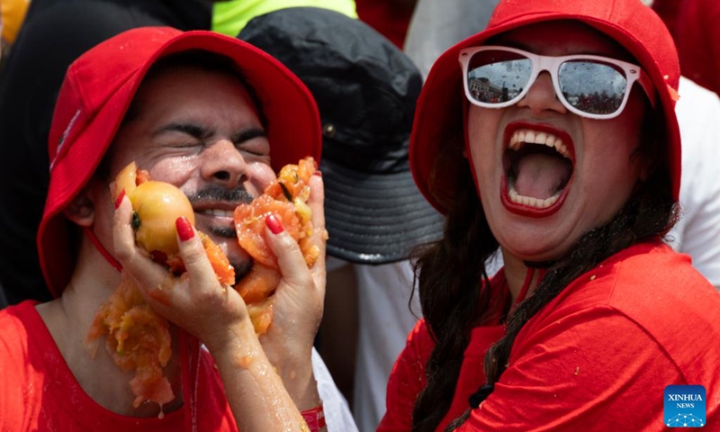 People have tomato fight in a tomato pool during Hwacheon Tomato Festival in Hwacheon-gun, South Korea, Aug. 2, 2025. Photo: Xinhua