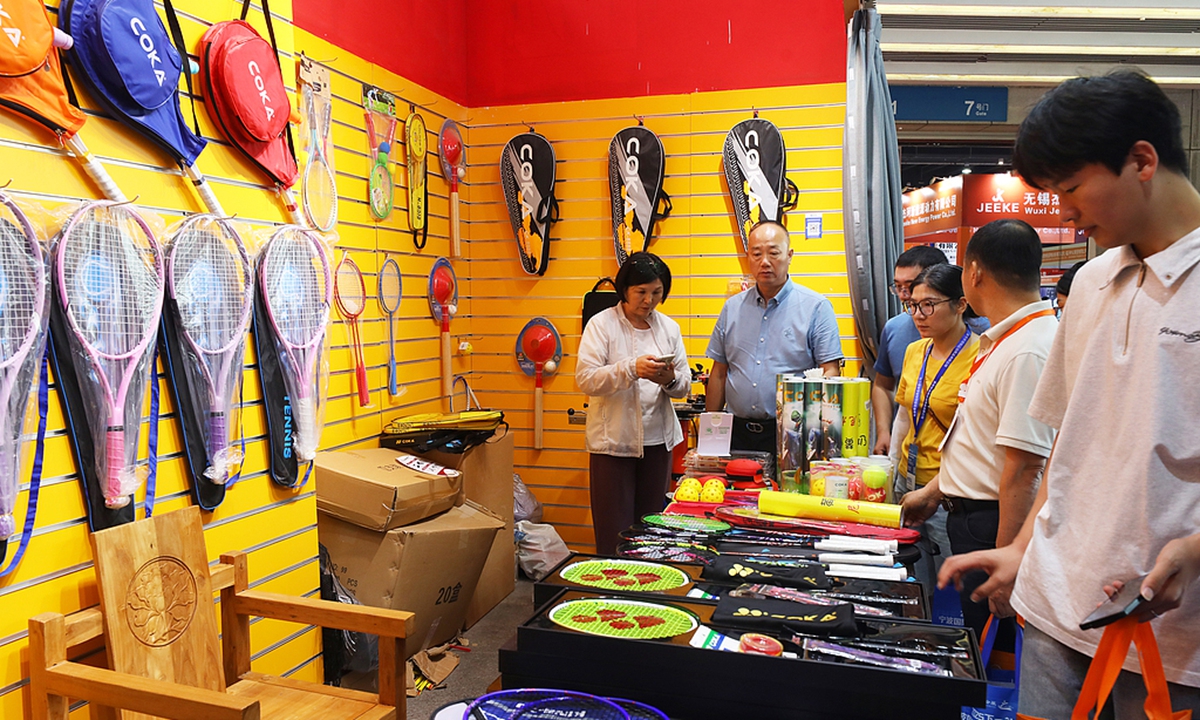Buyers select badminton rackets at the 3rd Yiwu Sports and Leisure Goods Expo at the Yiwu International Expo Center in Yiwu, East China's Zhejiang Province, on August 3, 2025. Dubbed the