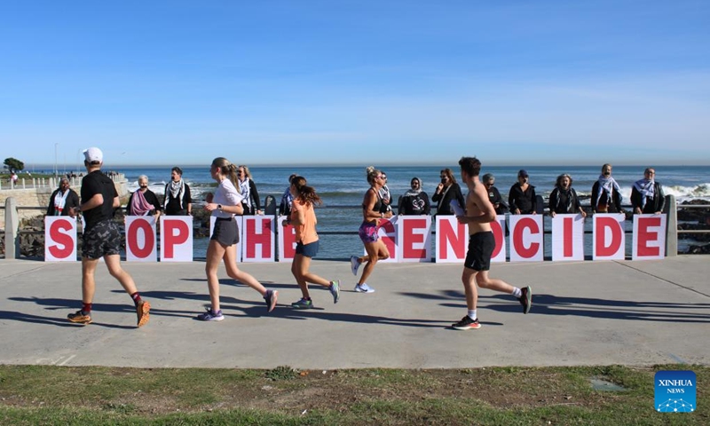 People hold a silent protest against mass starvation and genocide in Gaza, in Sea Point, Cape Town, South Africa, Aug. 2, 2025. Photo: Xinhua