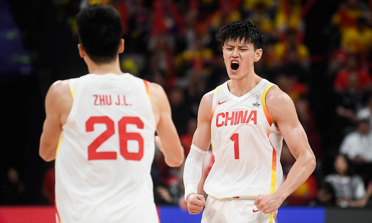 Zeng Fanbo (right) celebrates after scoring during a FIBA Asia Cup qualifier against Japan on February 20, 2025 in Shenzhen, South China's Guangdong Province. Photo: VCG