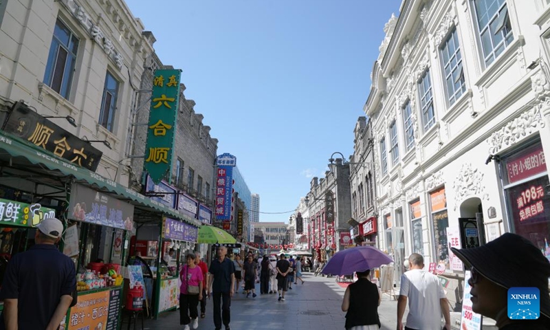 People visit the Chinese Baroque Historic and Cultural Block in Harbin, northeast China's Heilongjiang Province, on July 30, 2025.
Attracted by the coolness in summer, many tourists come to Harbin for vacation.
Taking advantage of its historical heritage, Harbin in recent years has accelerated the transformation of historical and cultural blocks and the utilization of old buildings, which has promoted the prosperity of the city's tourism industry. Photo: Xinhua