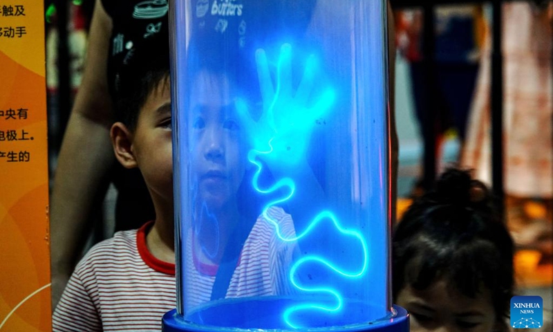A child interacts with an installation at a science and technology museum in Nanning, south China's Guangxi Zhuang Autonomous Region, Aug. 2, 2025. Photo: Xinhua