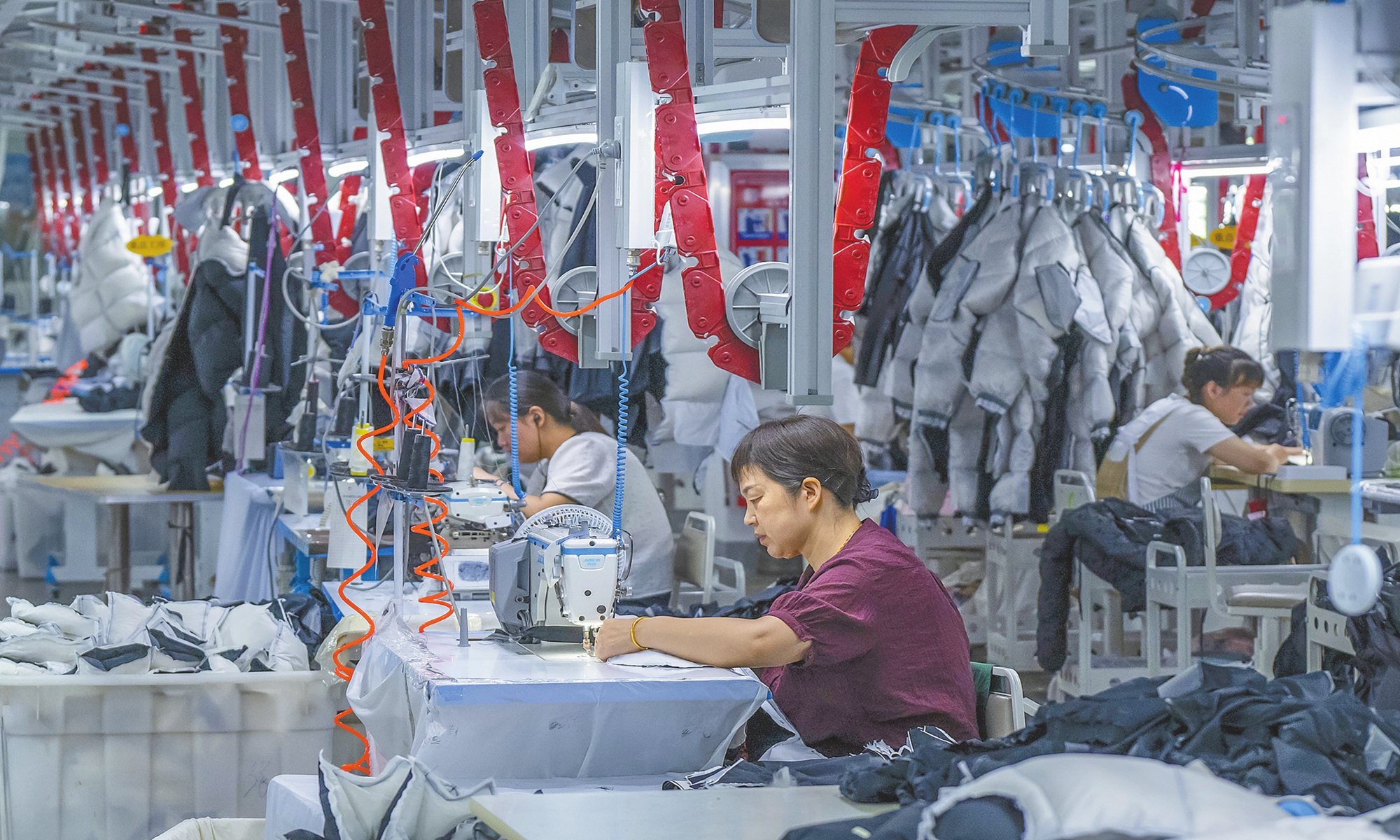 Workers work on a clothing production line for export orders at a smart manufacturing facility in Wuhu, East China's Anhui Province on August 4, 2025. Photo: VCG