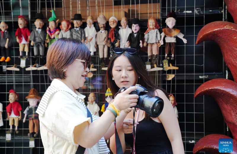 People visit a scenic spot on the Central Street in Harbin, northeast China's Heilongjiang Province, on July 30, 2025.
Attracted by the coolness in summer, many tourists come to Harbin for vacation.
Taking advantage of its historical heritage, Harbin in recent years has accelerated the transformation of historical and cultural blocks and the utilization of old buildings, which has promoted the prosperity of the city's tourism industry. Photo: Xinhua
