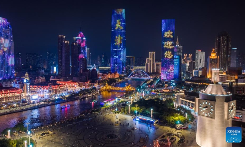 An aerial drone photo taken on Aug. 1, 2025 shows a night view along the Haihe River in north China's Tianjin. To improve its urban landscape at night, Tianjin has upgraded the lighting installations for 216 buildings, 13 bridges, 8.2 kilometers of riverbanks and 7 piers along the Haihe River so far in 2025. Photo: Xinhua