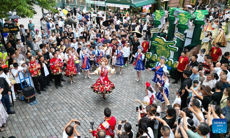 A drone photo taken on July 26, 2025 shows performers dancing during a float parade on the Central Street in Harbin, northeast China's Heilongjiang Province.
Attracted by the coolness in summer, many tourists come to Harbin for vacation.
Taking advantage of its historical heritage, Harbin in recent years has accelerated the transformation of historical and cultural blocks and the utilization of old buildings, which has promoted the prosperity of the city's tourism industry. Photo: Xinhua