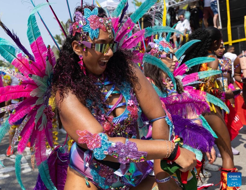 A dressed-up reveler poses for photos during the Grand Parade of the 2025 Toronto Caribbean Carnival in Toronto, Canada, on Aug. 2, 2025. This annual event was held here on Saturday to showcase Caribbean culture with thousands of masqueraders in stunning costumes. Photo: Xinhua