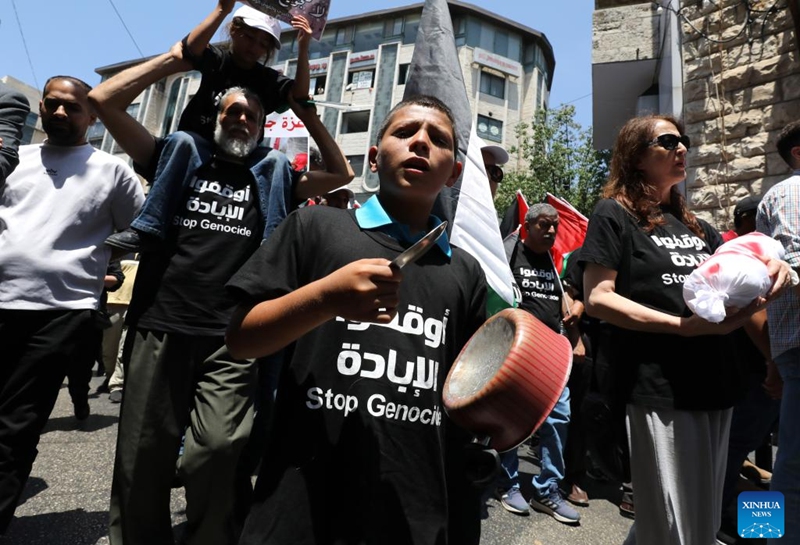 Palestinians participate in a demonstration against the ongoing war in the Gaza Strip, in the West Bank city of Ramallah, on Aug. 3, 2025. Thousands of Palestinians took to the street on Sunday in several West Bank cities, denouncing the ongoing Israeli military offensive on the Gaza Strip and its restriction on aid delivery, which has led to widespread malnutrition and starvation in the coastal enclave. (Photo by Nidal Eshtayeh/Xinhua)