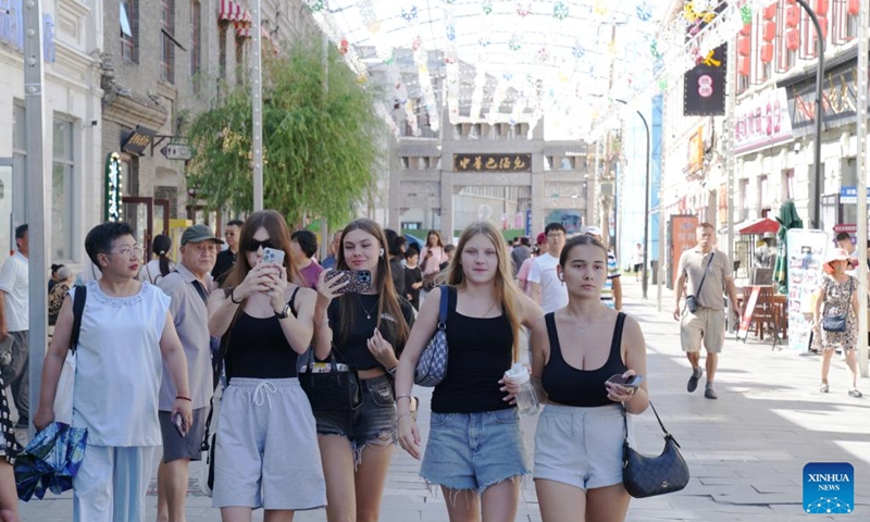 People visit the Chinese Baroque Historic and Cultural Block in Harbin, northeast China's Heilongjiang Province, on July 30, 2025.
Attracted by the coolness in summer, many tourists come to Harbin for vacation.
Taking advantage of its historical heritage, Harbin in recent years has accelerated the transformation of historical and cultural blocks and the utilization of old buildings, which has promoted the prosperity of the city's tourism industry. Photo: Xinhua