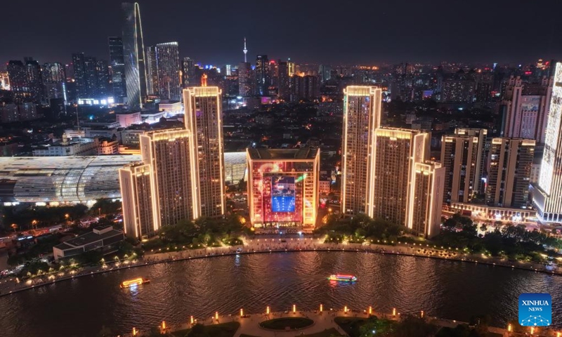 An aerial drone photo taken on Aug. 1, 2025 shows a night view along the Haihe River in north China's Tianjin. To improve its urban landscape at night, Tianjin has upgraded the lighting installations for 216 buildings, 13 bridges, 8.2 kilometers of riverbanks and 7 piers along the Haihe River so far in 2025. Photo: Xinhua