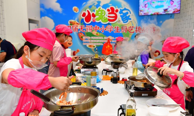 Children participate in a cooking contest in Wuxi, east China's Jiangsu Province, Aug. 3, 2025. Photo: Xinhua