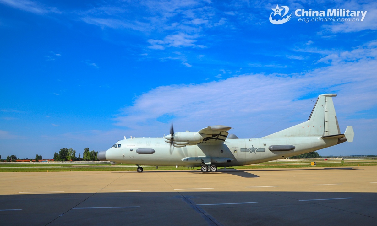 A reconnaissance aircraft attached to an aviation unit under the Chinese PLA Navy taxis on the runway during a round-the-clock flight training exercise held recently. (eng.chinamil.com.cn/Photo by Wang Shuo and Wu Zhiyang)