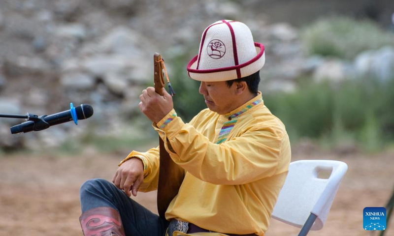 A man plays traditional musical instruments during a folk arts festival at the south bank of the Issyk-Kul Lake, Kyrgyzstan, Aug. 2, 2025. Photo: Xinhua