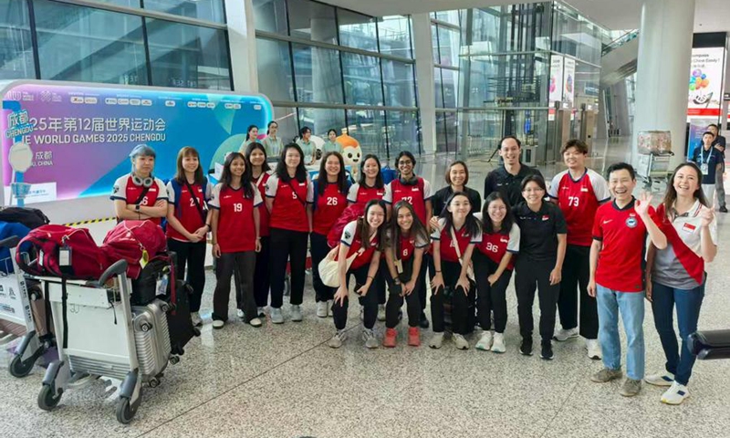 Singapore's floorball team members pose for a photo after arriving at Chengdu Tianfu International Airport for the 12th World Games on Aug. 3, 2025. (Xinhua/Bian Siqi)