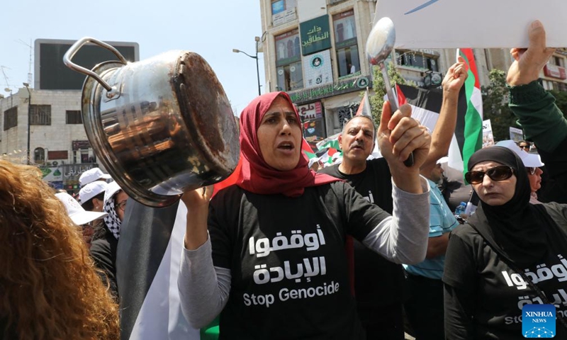 Palestinians participate in a demonstration against the ongoing war in the Gaza Strip, in the West Bank city of Ramallah, on Aug. 3, 2025. Thousands of Palestinians took to the street on Sunday in several West Bank cities, denouncing the ongoing Israeli military offensive on the Gaza Strip and its restriction on aid delivery, which has led to widespread malnutrition and starvation in the coastal enclave. (Photo by Nidal Eshtayeh/Xinhua)