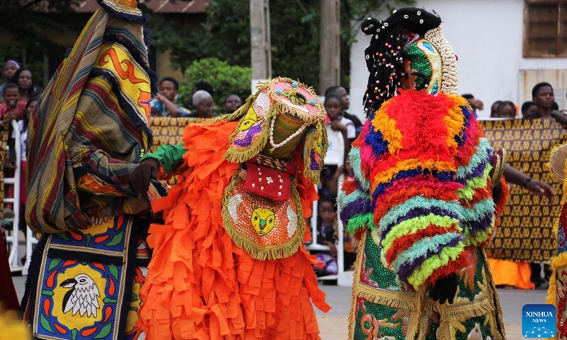 People in costumes perform in a mask parade during the Porto Novo Mask Festival in Porto Novo, Benin, Aug. 3, 2025. The festival was held here from Saturday to Sunday to showcase the art and culture of Benin's traditional religion Vodun through a mask parade, concerts, seminars and other activities. (Photo by Seraphin Zounyekpe/Xinhua)