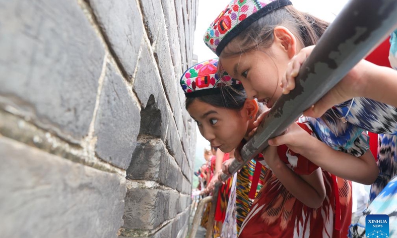 Patimanhan Parihat (L) and her friends visit the Badaling section of the Great Wall in Beijing, capital of China, July 28, 2025.
