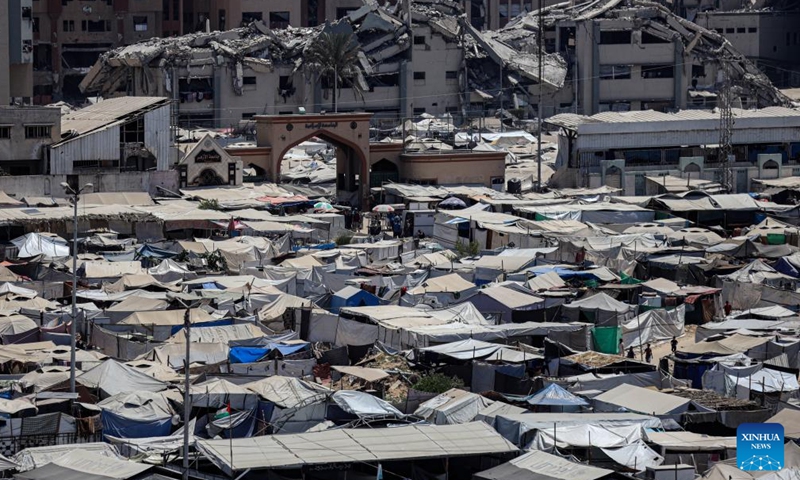 Tents for displaced Palestinians are seen at a temporary shelter in Gaza City, on Aug. 4, 2025. Gaza-based health authorities on Monday said at least 9,440 Palestinians have been killed and 37,986 others injured since Israel renewed its intensive strikes in Gaza on March 18, bringing the total death toll since October 2023 to 60,933, and injuries to 150,027. (Photo by Rizek Abdeljawad/Xinhua)