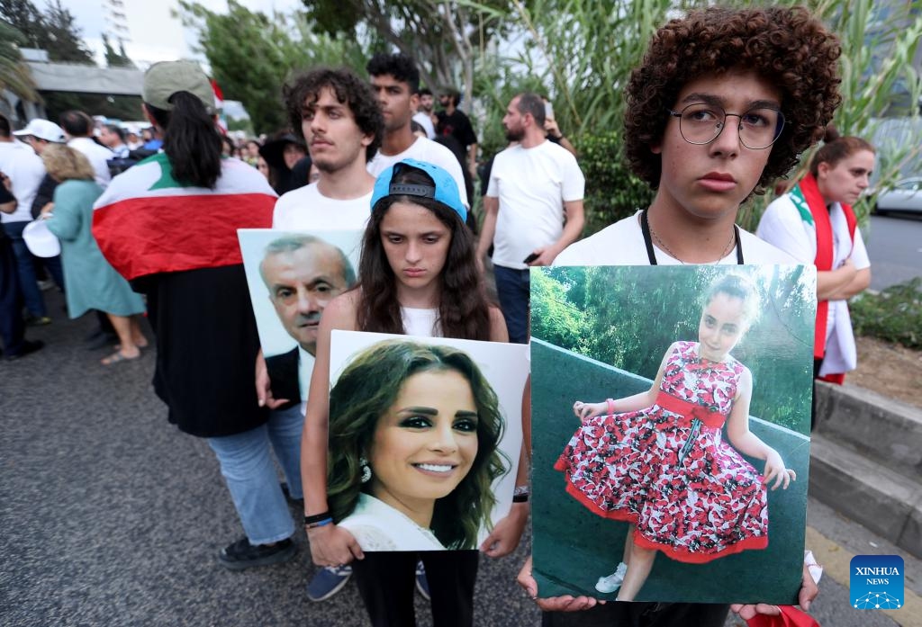 People take part in a march to commemorate the victims of the Beirut port blast in Beirut, Lebanon, on Aug. 4, 2025. Hundreds of people, including families of the victims and wounded from the catastrophic Beirut port explosion in 2020, gathered here on Monday in Martyrs' Square and marched toward the port to commemorate the tragedy. (Photo by Bilal Jawich/Xinhua)
