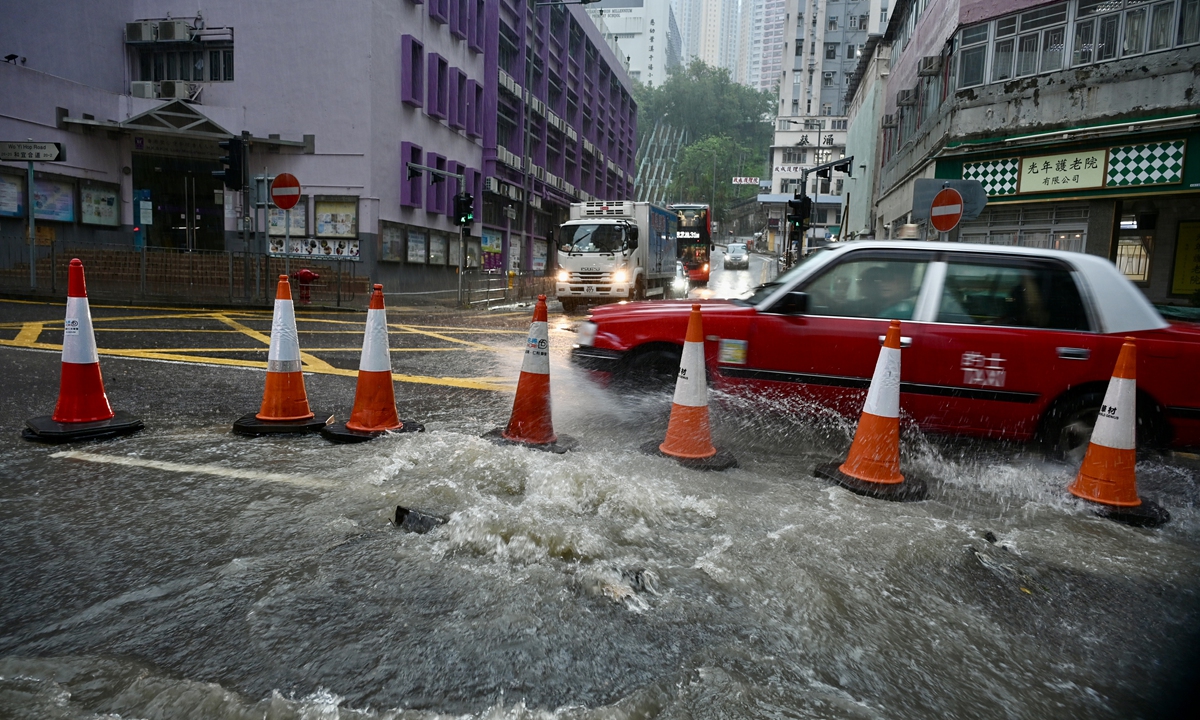 Rainwater gushes out from a drainage channel in Wo Yi Hop Road in the Hong Kong Special Administrative Region on August 5, 2025. The Hong Kong observatory issued a black rainstorm warning indicating that the region is experiencing massive rainfall. Photo: VCG