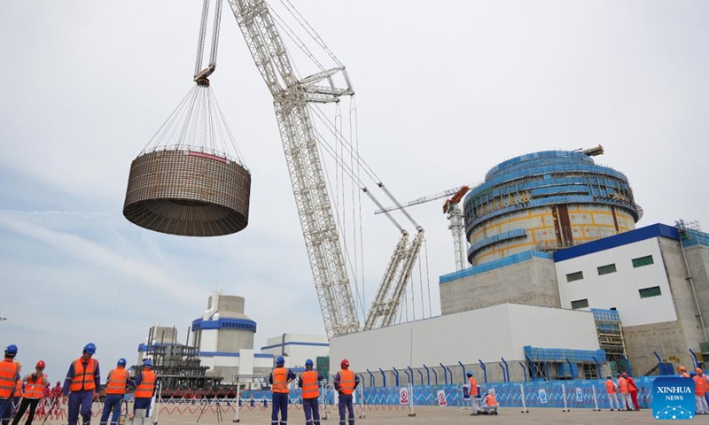 A crane lifts the CB20 module of the nuclear island for the 3rd unit of the Haiyang Nuclear Power Plant in Haiyang, east China's Shandong Province, Aug. 4, 2025. The CB20 module was successfully lifted and positioned on Monday, marking the completion of all major module installations for the 3rd unit of the Haiyang Nuclear Power Plant and the start of equipment installation and commissioning phase. (Photo by Tang Ke/Xinhua)